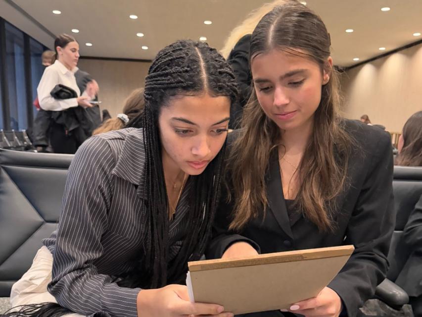 Mackenzie Thomas (L) and Juliet Shah (R) preparing for their mock trial case before entering the courtroom.  St. Francis Catholic High School Sacramento, CA