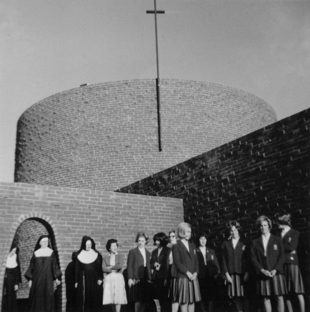 Sisters with students in front of St. Francis High School in 1965