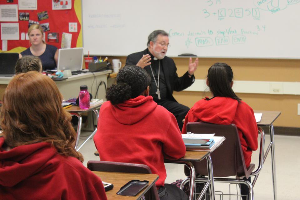 Bishop Soto speaking with an incoming freshman class taking a summer course.